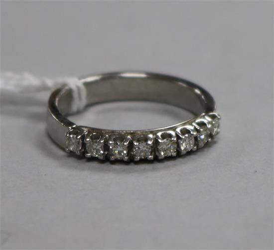 An 18ct gold and diamond set half eternity ring, size P.